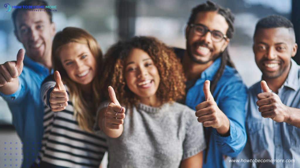 group of business people giving thumbs up while standing in the office