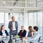 humble leader listening to team members in a meeting, effective leadership with humility